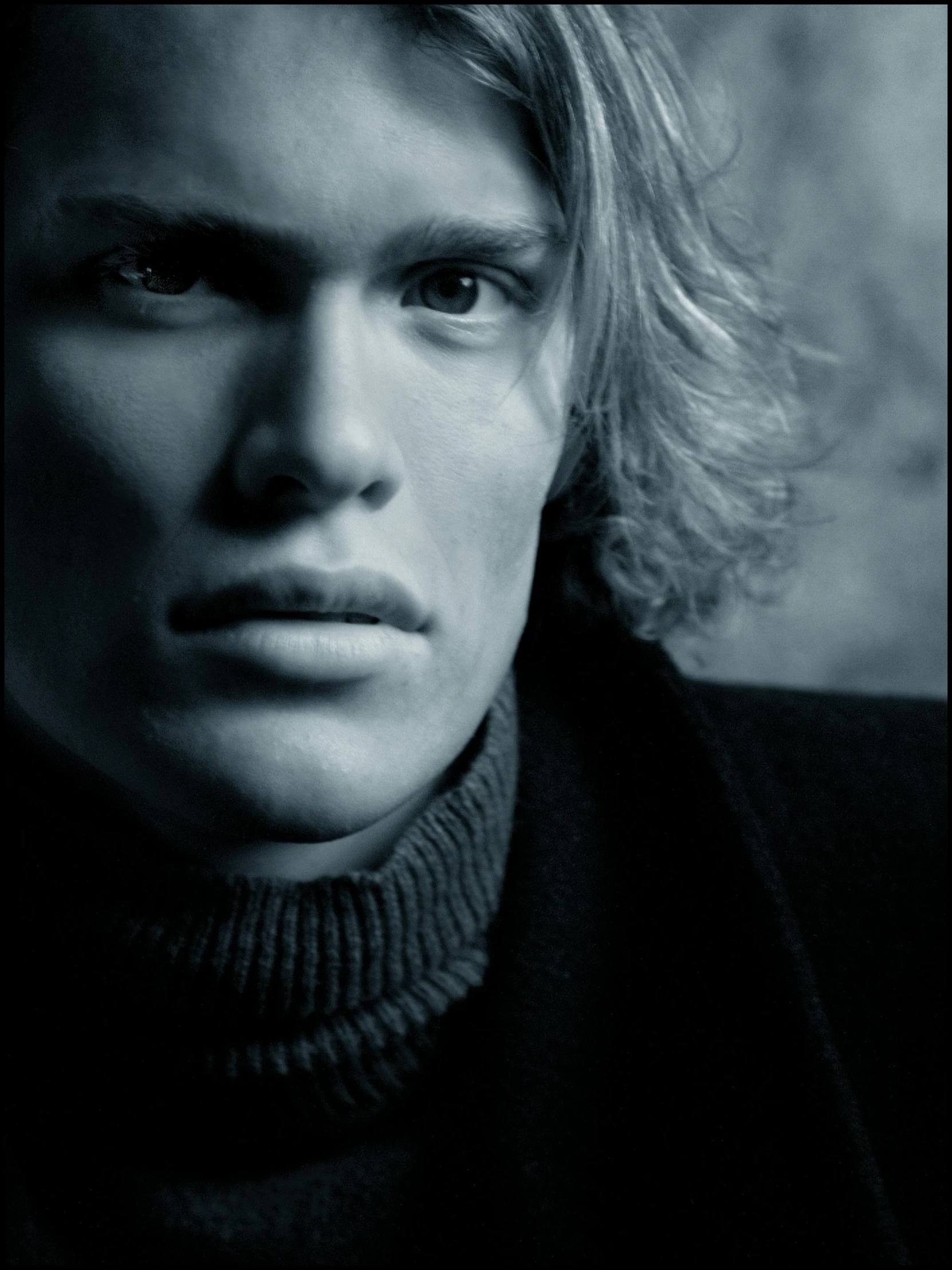 a black and white photo of a young man, an album cover, inspired by Sergei Sviatchenko, unsplash, greg olsen, one man is blond, taken in the late 2000s, dio brando