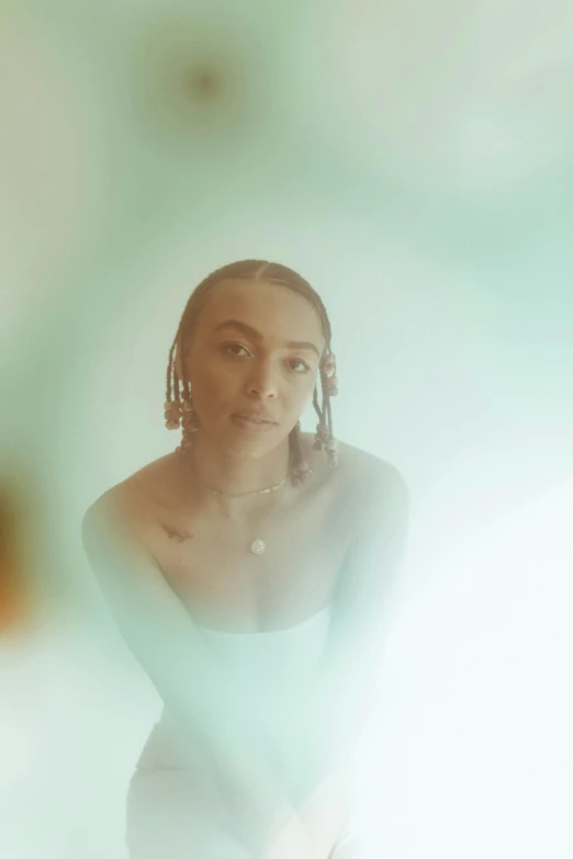 a woman in a white dress posing for a picture, an album cover, by Stokely Webster, trending on pexels, ashteroth, delicate soft hazy lighting, bubbles, portrait sophie mudd