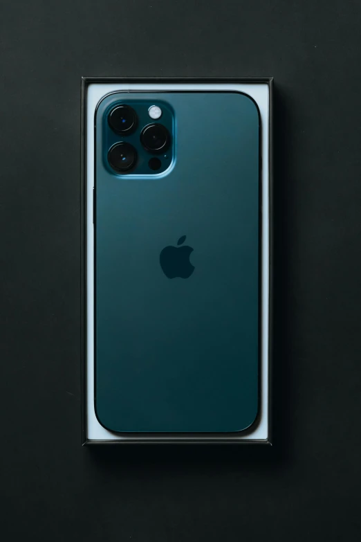 a green iphone sitting on top of a black surface, a picture, trending on pexels, photorealism, 256x256, box, sony nicon iphone 1 3 pro max, dark blue skin