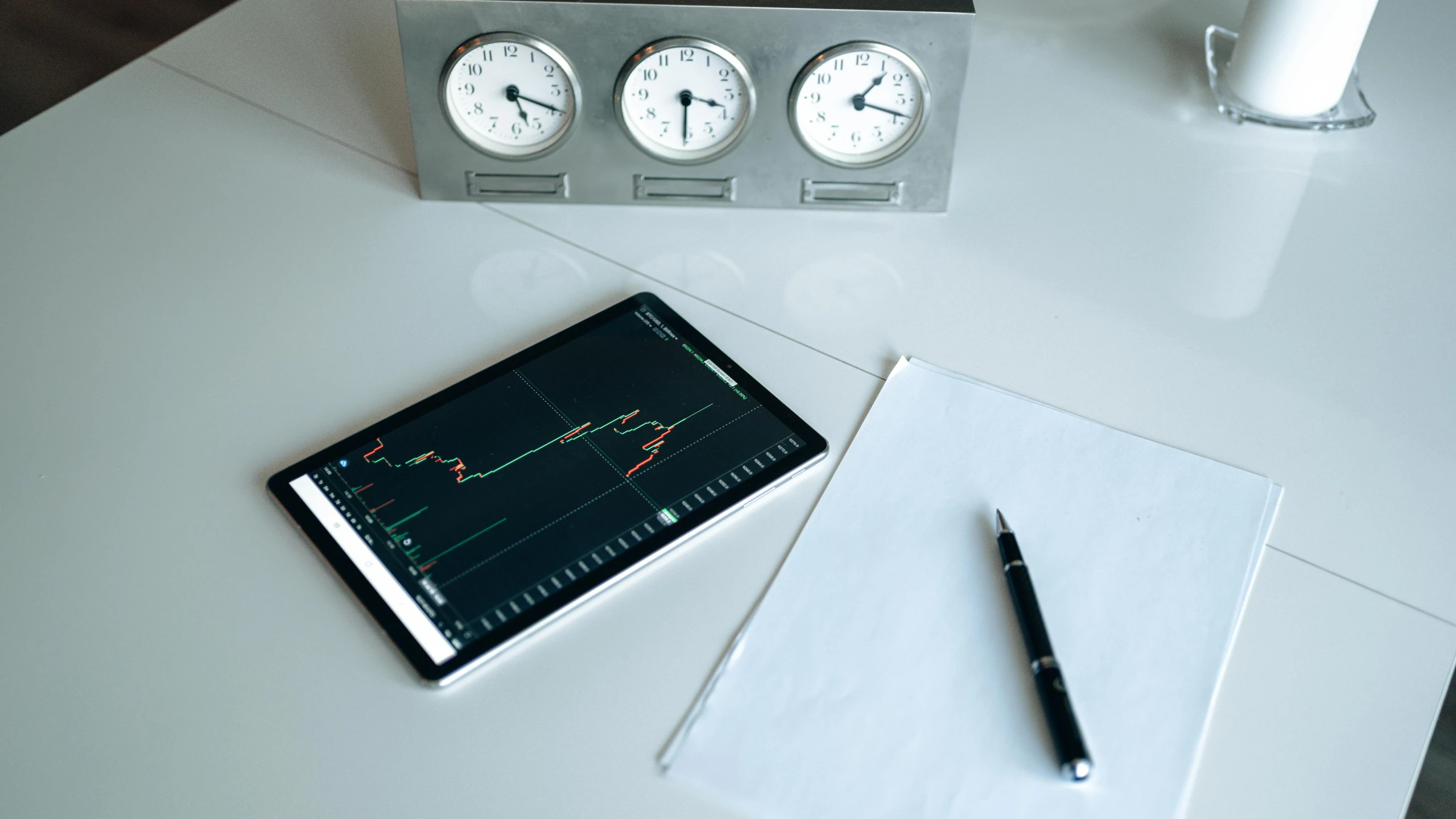 a tablet computer sitting on top of a white table, analytical art, gauges, clock, thumbnail, portrait n - 9