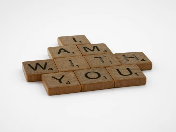 scrabbles spelling i am with you on a white background, inspired by Ian Hamilton Finlay, letterism, vintage - w 1 0 2 4, a wooden, teaser, brown