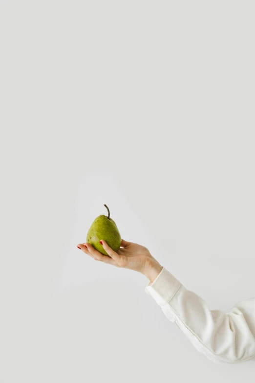 a woman holding a green apple in her hand, by Gavin Hamilton, trending on pexels, minimalism, pear, ilustration, white, square