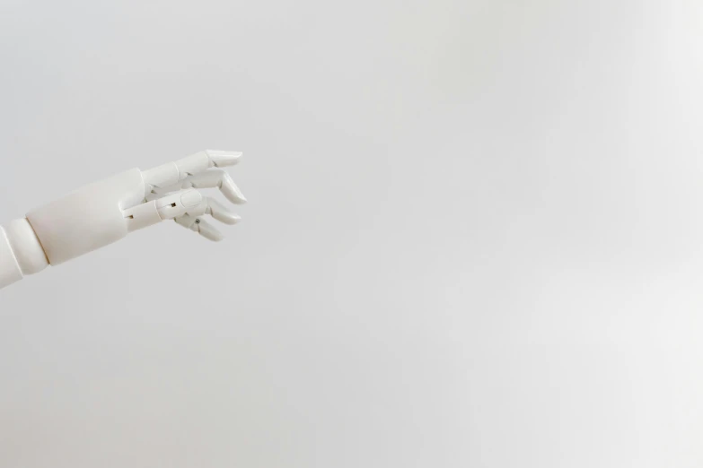 a robotic hand reaching for something in the air, by Emma Andijewska, unsplash, white soft leather model, white and grey, gif, 🦑 design