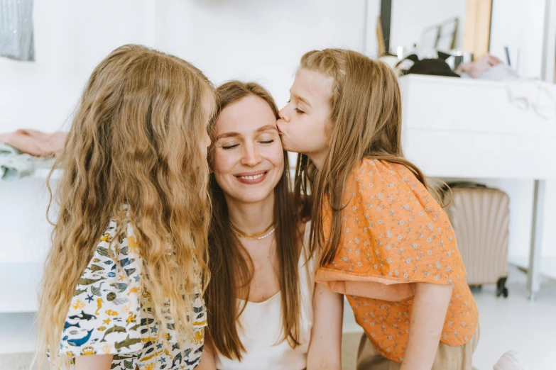 a mother kissing her two daughters on the cheek, pexels contest winner, avatar image, manuka, 1 2 9 7, unique design