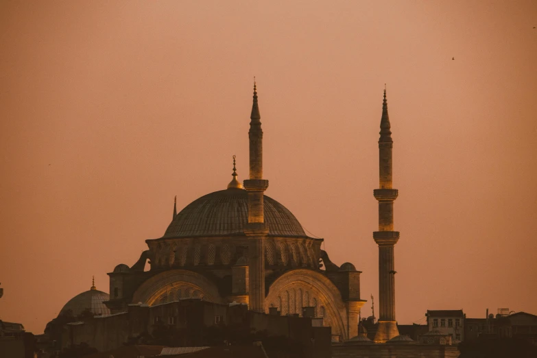 a large building in the middle of a city, pexels contest winner, hurufiyya, ottoman empire era, faded glow, profile image, mosque