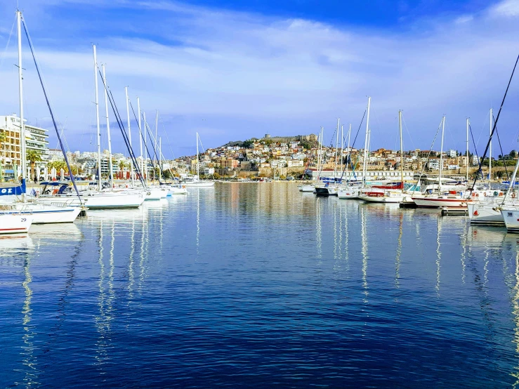 a large body of water filled with lots of boats, a photo, pexels contest winner, renaissance, athene, clear and sunny, thumbnail, small port village
