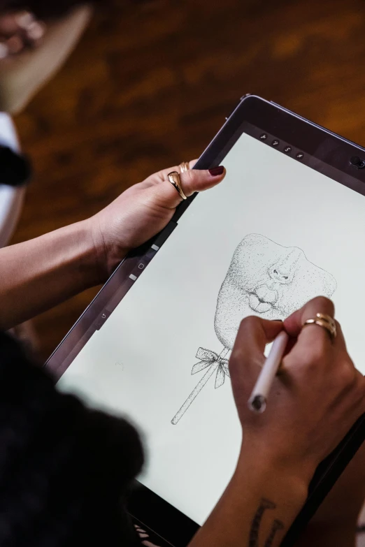 a close up of a person drawing on a tablet, a drawing, large portrait, tech demo, brown, fan favorite