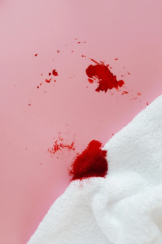 a white towel with a red stain on it, inspired by Julian Schnabel, trending on pexels, happening, blood spray, pink skin, red, with violence