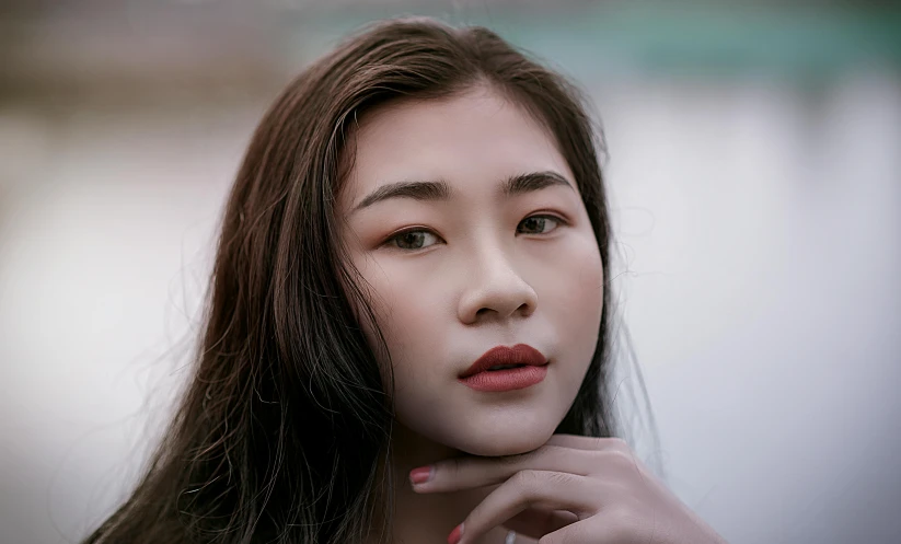 a close up of a woman with long hair, inspired by Wen Jia, trending on pexels, round chin, thoughtful pose, hyperrealistic teen, professional closeup photo