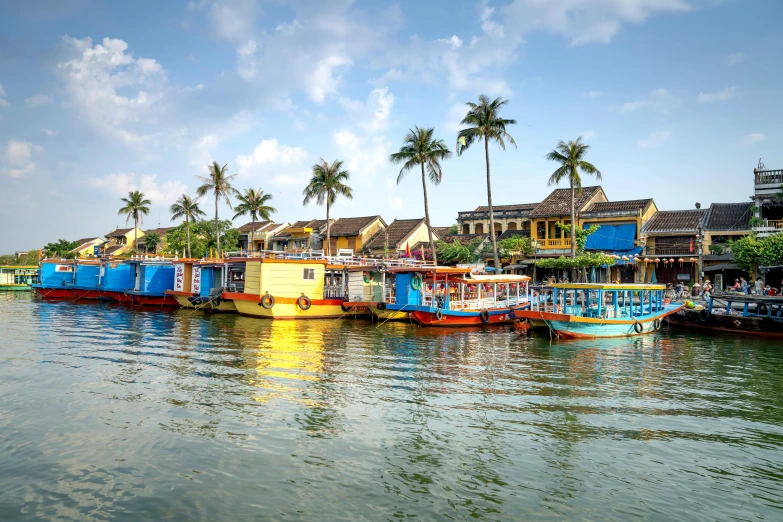 a number of boats in a body of water, by Tom Wänerstrand, pexels contest winner, ao dai, colorful architecture, avatar image, thumbnail