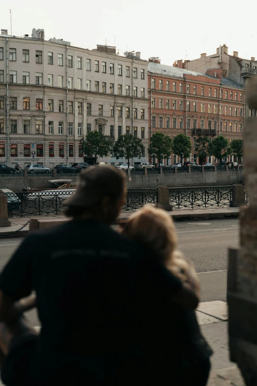 a couple of people that are standing in the street, by Dmitry Levitzky, pexels contest winner, renaissance, river in the background, saint petersburg, facing away, low quality footage