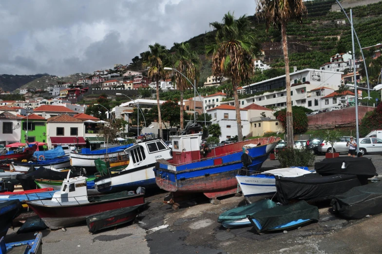 a bunch of boats that are sitting in the sand, a picture, white buildings with red roofs, azores, avatar image