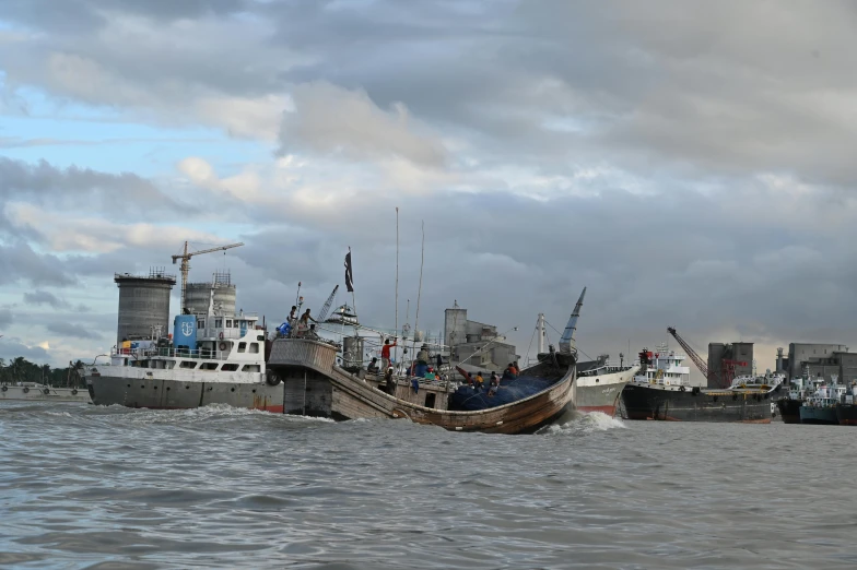 a couple of boats that are in the water, a photo, by Sven Erixson, hurufiyya, preparing to fight, london, sakimichan, group photo