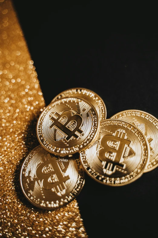 three gold bitcoins sitting on top of a gold tie, by Julia Pishtar, trending on unsplash, renaissance, sequins, thumbnail, black, 420