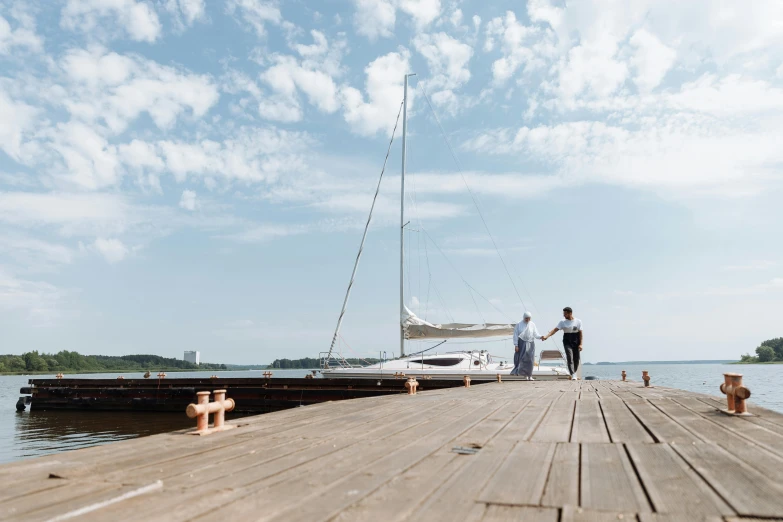 a man and a woman standing on a dock next to a boat, pexels contest winner, hurufiyya, helsinki, sailboat, on a wooden table, thumbnail