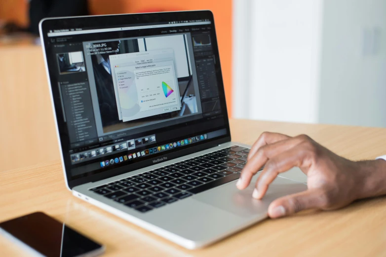 a close up of a person typing on a laptop, a computer rendering, pexels, blender and photoshop, apple, linux mint, thumbnail