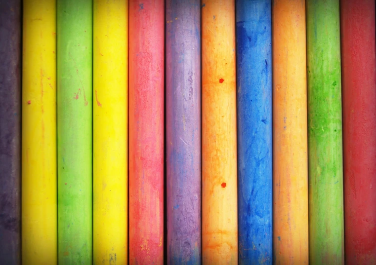 a close up of a multicolored wooden wall, chalk art, pexels, crayon art, solid colour background”