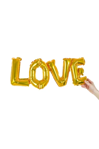 a woman holding up a gold love balloon, inspired by Germán Londoño, white bg, inflateble shapes, sunlit, letters