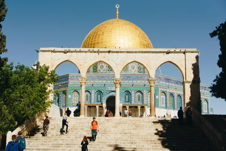 a group of people that are standing in front of a building, a marble sculpture, by Julia Pishtar, trending on unsplash, dome of the rock, gold and teal color scheme, square, aida muluneh