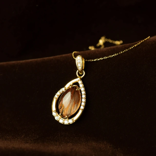 a close up of a necklace on a cloth, topaz, detailed product image, thumbnail, 8 k 4 k