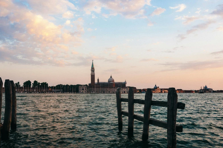 a large body of water with a clock tower in the background, pexels contest winner, renaissance, venice biennale, magic hour, trending on vsco, lake in the distance