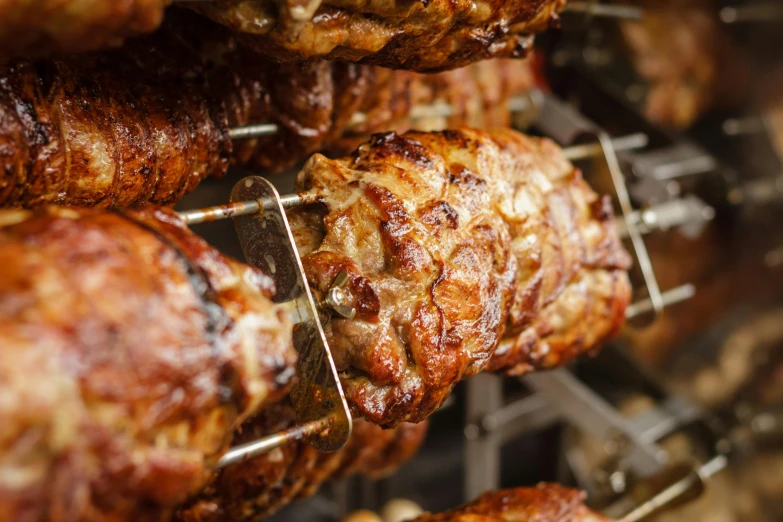 a bunch of meat sitting on top of a rack, a photo, unsplash, hurufiyya, greek ameera al taweel, glazed, profile image, detail shot