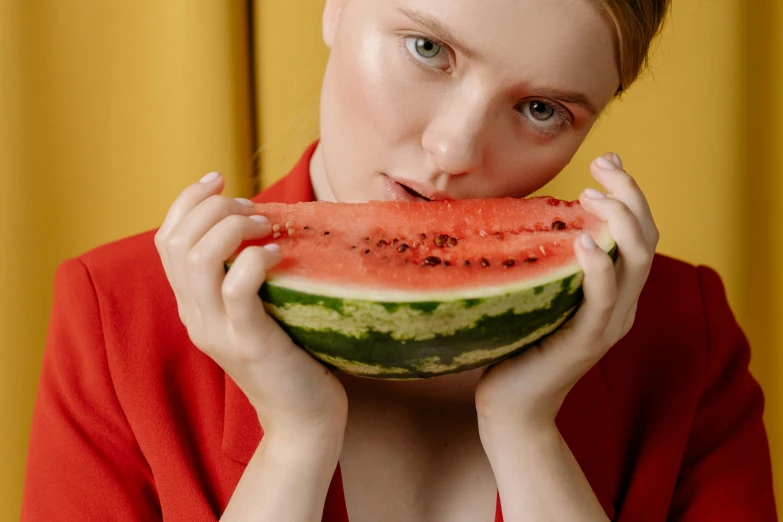 a woman holding a slice of watermelon in front of her face, a photo, by Julia Pishtar, pexels contest winner, elle fanning), maxim sukharev, red dish, youtube thumbnail