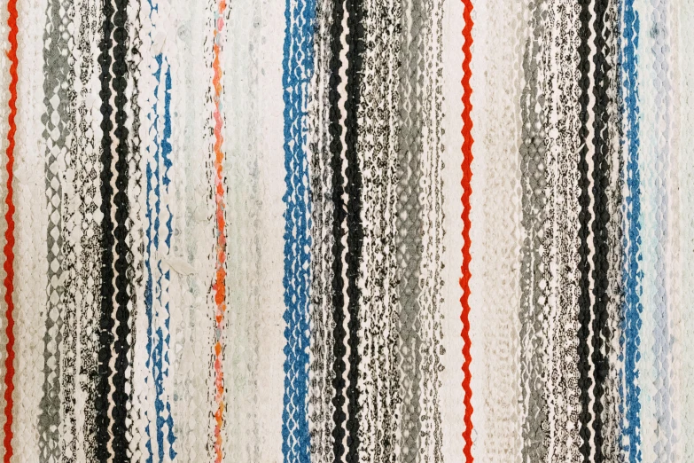 a striped rug with red, white, and blue stripes, inspired by Howardena Pindell, unsplash, beaded curtains, dark grey and orange colours, clear detailed view, vintage - w 1 0 2 4