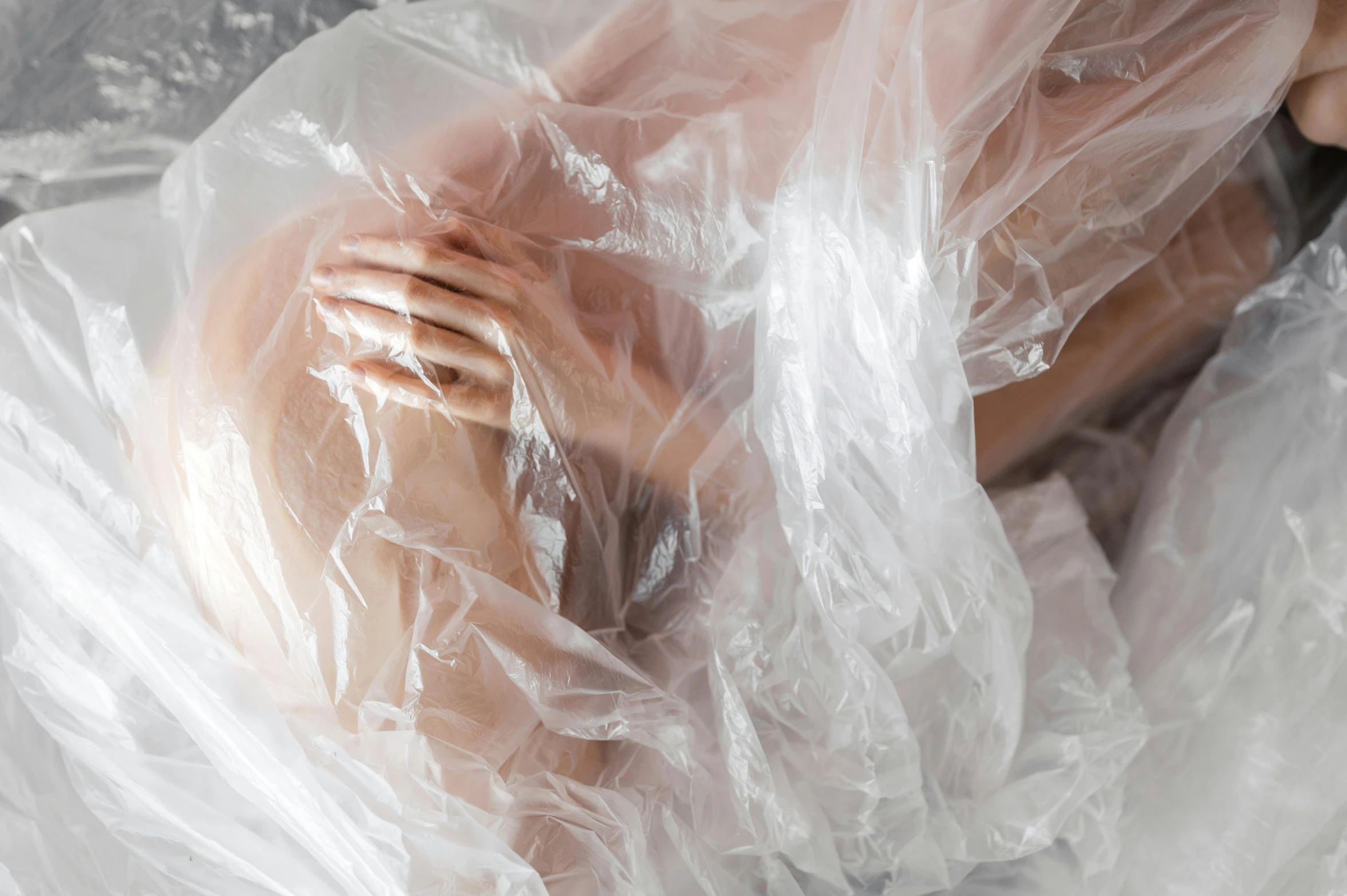 a naked woman is wrapped up in plastic, inspired by Elsa Bleda, unsplash contest winner, porcelain organic tissue, lachlan bailey, promo photo, rectangle