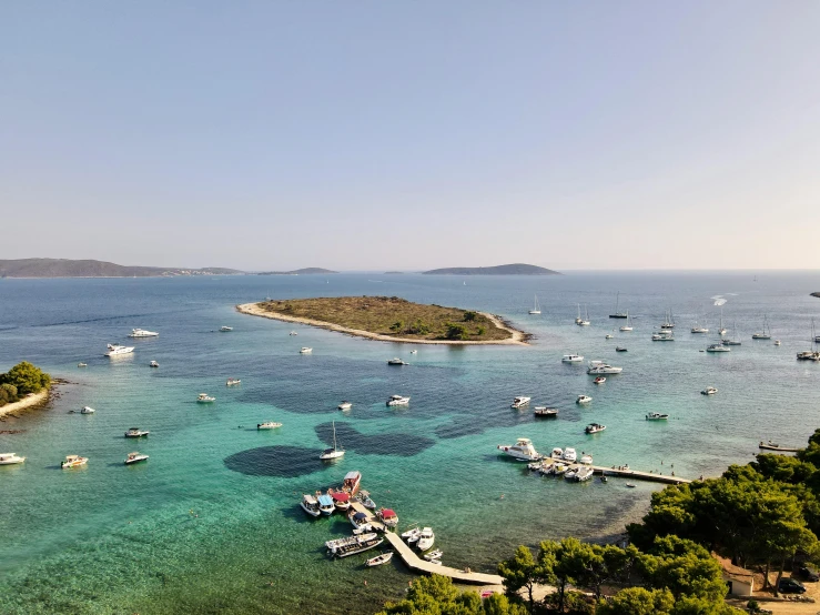 a large body of water filled with lots of boats, pexels contest winner, croatian coastline, island background, conde nast traveler photo, video