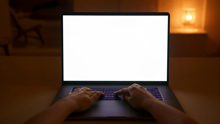 a person typing on a laptop with a white screen, by Carey Morris, pexels, computer art, holding up a night lamp, large screen, rectangle, thumbnail