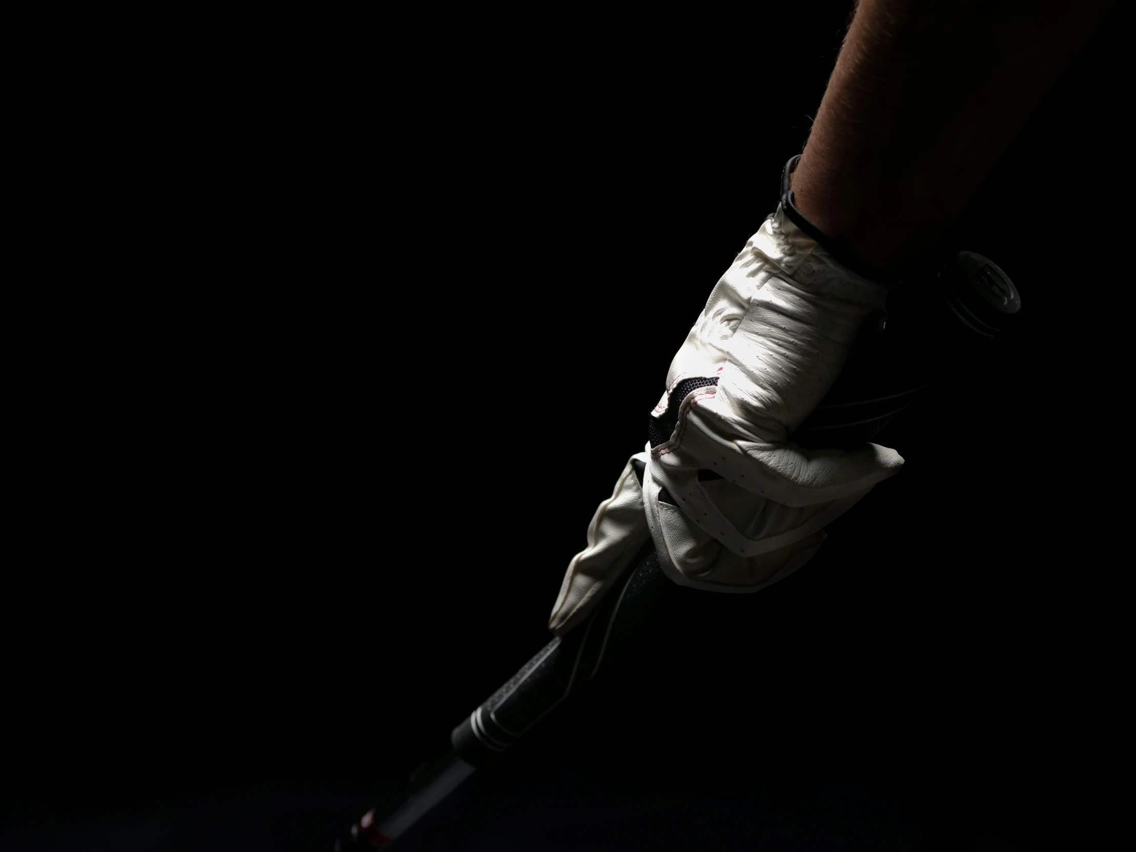 a close up of a person holding a tennis racket, by Adam Chmielowski, lacrosse player, white gloves, dark and white, getting ready to fight