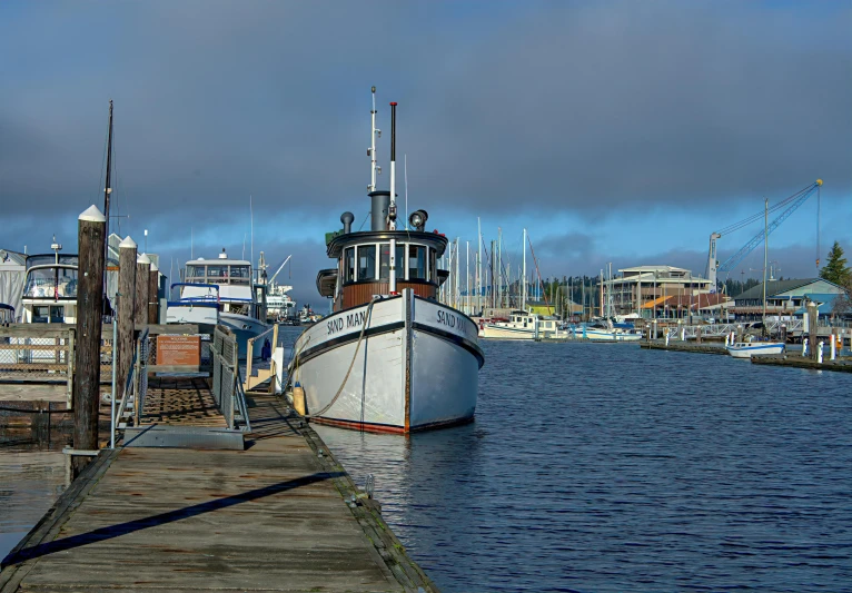 a large boat sitting on top of a body of water, by Jim Nelson, pixabay contest winner, docked at harbor, cascadia, thumbnail, dunwall city