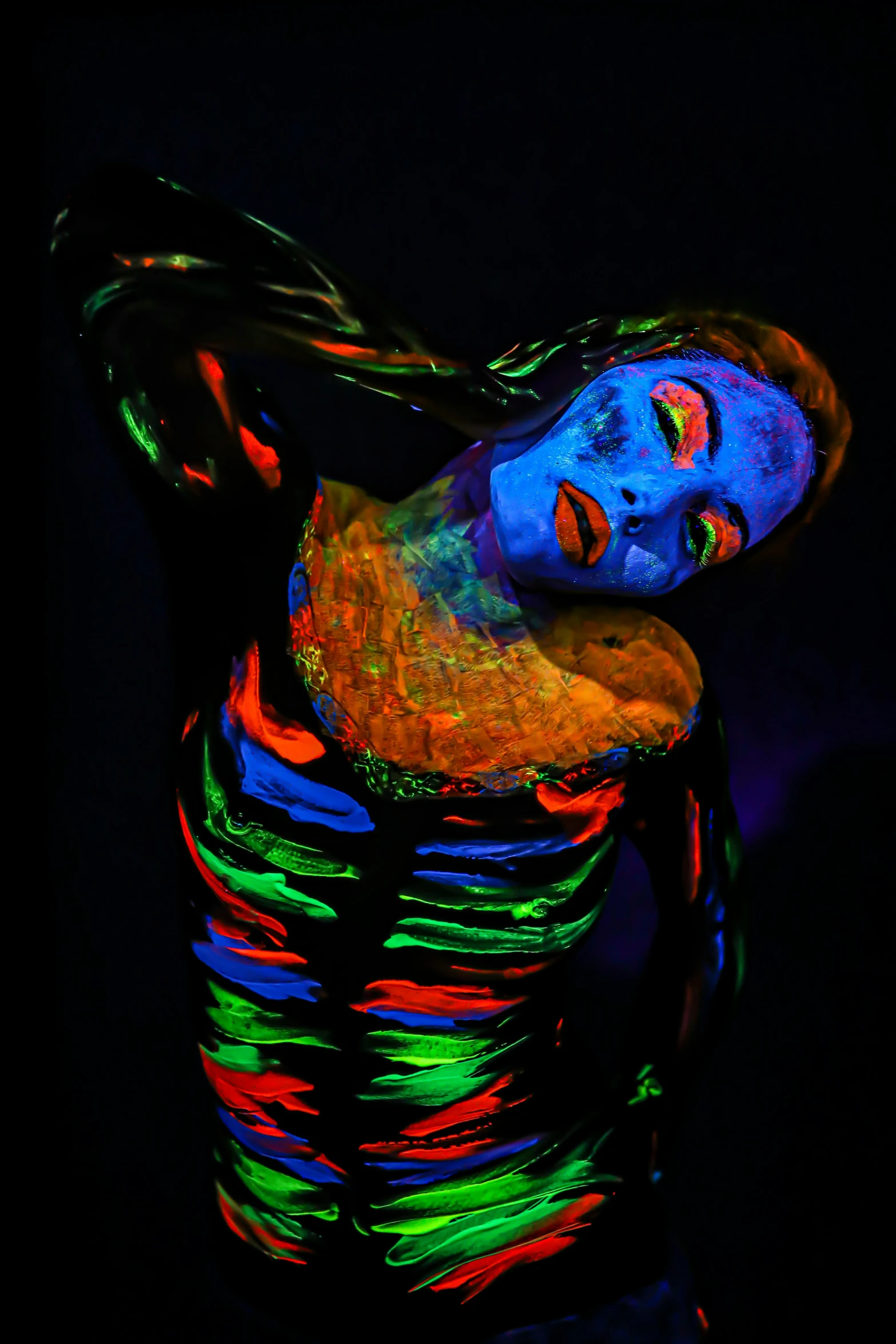 a woman that is standing in the dark, pexels contest winner, art photography, psychedelic black light, skintight rainbow body suit, vibrant neon inks painting, taken in the late 2010s