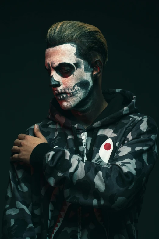 a man with a skull face painted on his face, an album cover, inspired by Taro Yamamoto, trending on reddit, wearing camo, jujutsu kaisen, ( ( theatrical ) ), techwear clothes