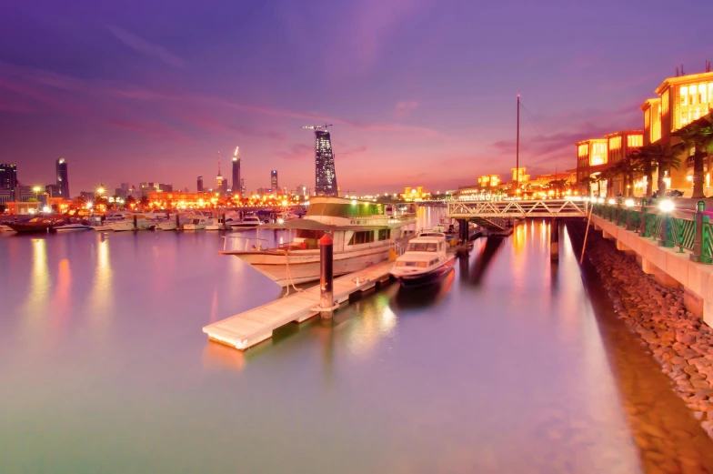 a large body of water next to a city, pexels contest winner, hurufiyya, boat dock, soft glow, spanish, 8k resolution”