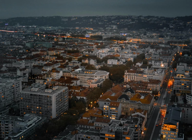 an aerial view of a city at night, pexels contest winner, renaissance, lisbon, slight overcast lighting, brutalist city, cinematic paris