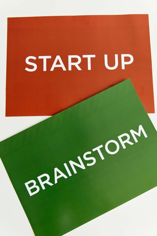 two business cards with the words brainstorm on them, by Barron Storey, ap, green and red, ai startup, 1 6 x 1 6