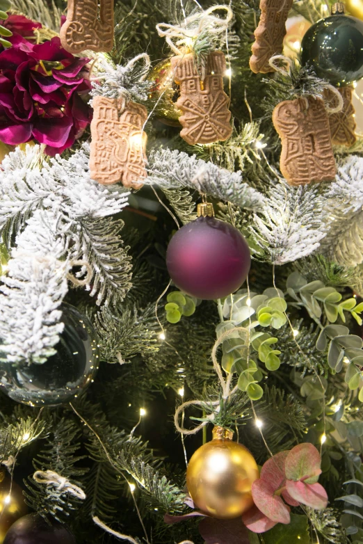 a close up of a christmas tree with ornaments, inspired by Ernest William Christmas, baroque, purple foliage, award - winning crisp details, botanicals, medium close shot