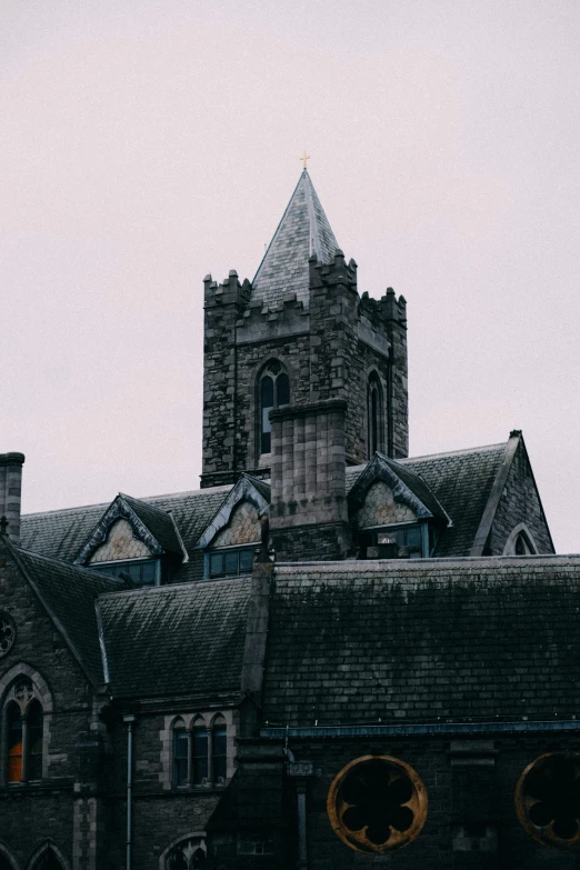 a church with a clock tower on top of it, by Kevin Connor, unsplash, romanesque, dark gloomy, hiding in the rooftops, book of kells, background image