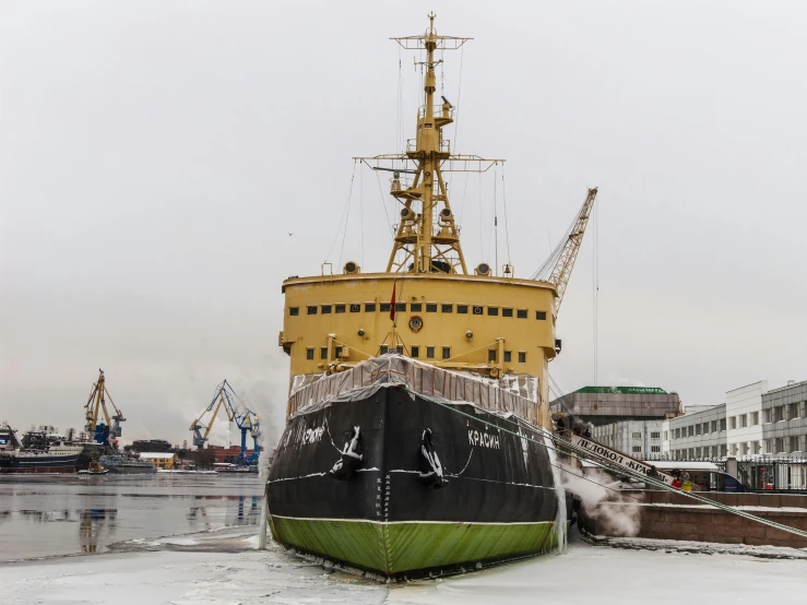 a large boat sitting on top of a body of water, by Sven Erixson, pexels contest winner, hurufiyya, covered in ice, shipyard, full front view, celebration