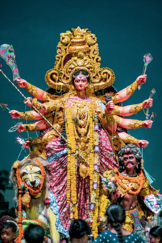 a group of people standing around a statue, a statue, pexels contest winner, bengal school of art, ifa deity, arms spread wide, elaborately costumed, square