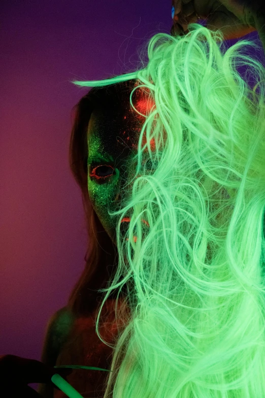 a close up of a person with green hair, an album cover, inspired by Elsa Bleda, neon radioactive swamp, long glowing hair, nick knight, alien colors