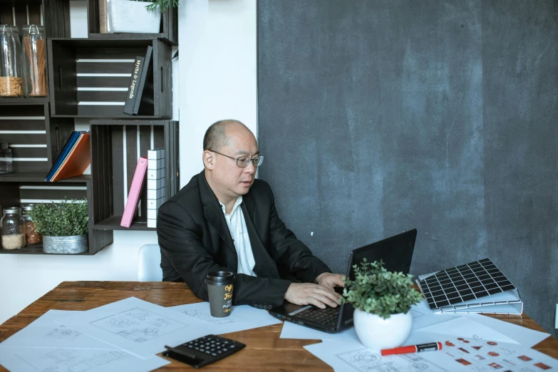 a man sitting at a table with a laptop computer, by Jang Seung-eop, pexels contest winner, avatar image, academy headmaster, 15081959 21121991 01012000 4k, asian human