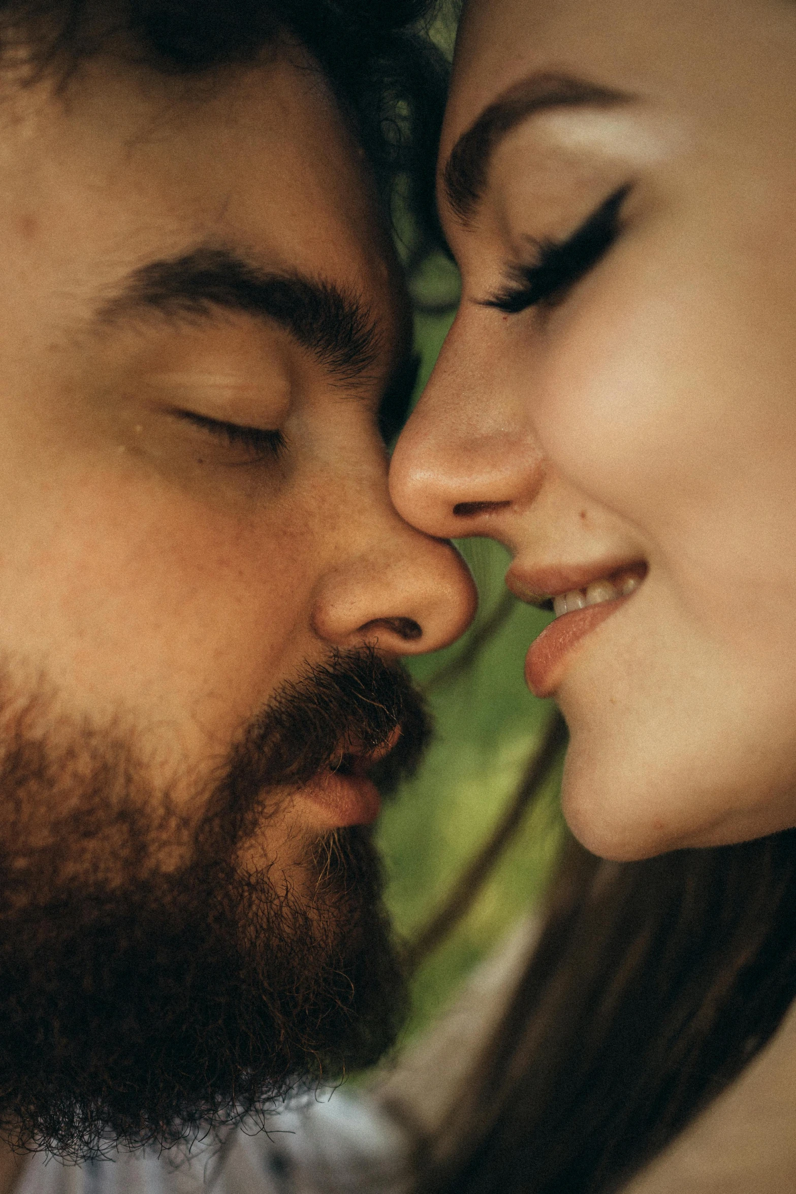 a close up of a person kissing a woman, a picture, inspired by Elsa Bleda, trending on pexels, renaissance, stubble beard, square masculine facial features, lustful vegetation, idyllic