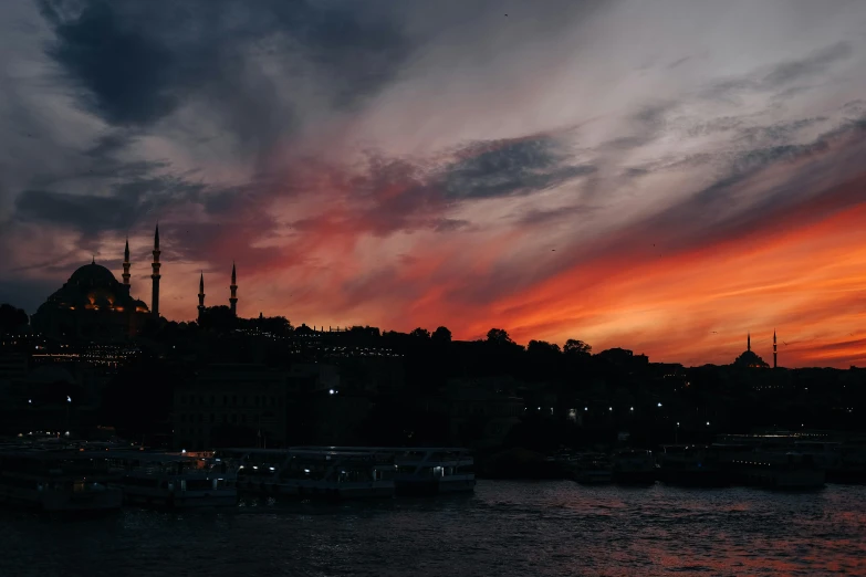 a sunset over a large body of water, by Cafer Bater, pexels contest winner, hurufiyya, istanbul, crimson themed, grey, black