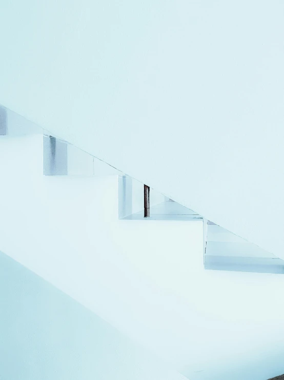 a man walking up a set of stairs in the snow, a minimalist painting, inspired by Tadao Ando, unsplash contest winner, hypermodernism, light blue and white tones, waterline refractions, square shapes, unsplash photo contest winner