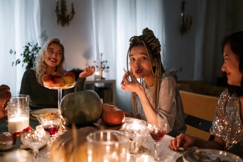 a group of women sitting around a dinner table, a portrait, trending on pexels, renaissance, trick or treat, avatar image, hammershøi, attractive girl