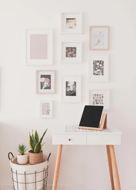 a white desk with a laptop on top of it, poster art, square pictureframes, using a magical tablet, high-quality photo, trending photo