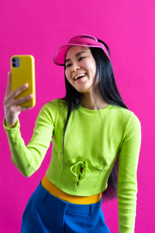 a woman taking a selfie with her cell phone, maximalism, lime green, young asian woman, ((pink)), yellow